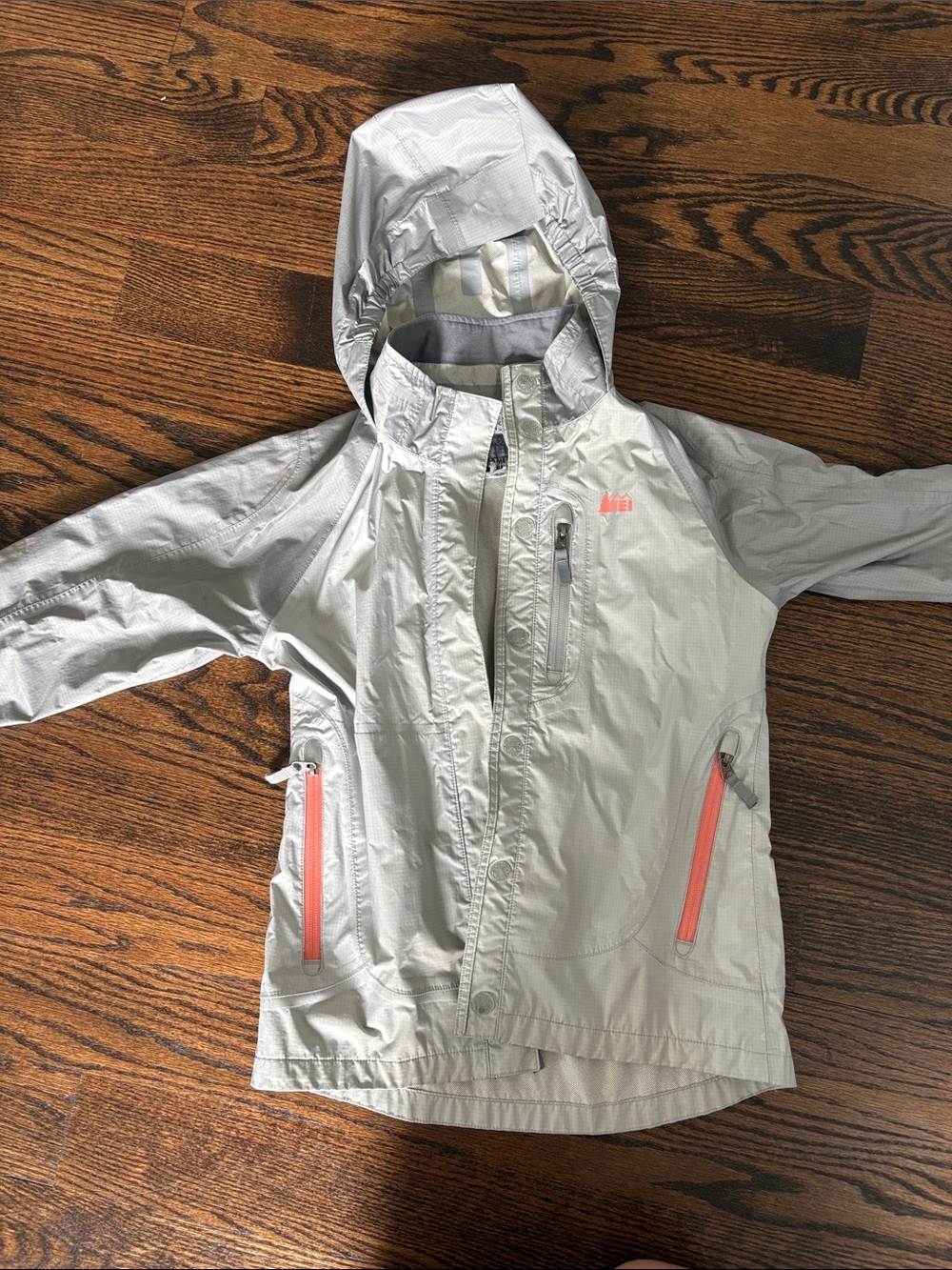 REI Kids Hooded Rain Jacket in Light Gray with Coral Accents